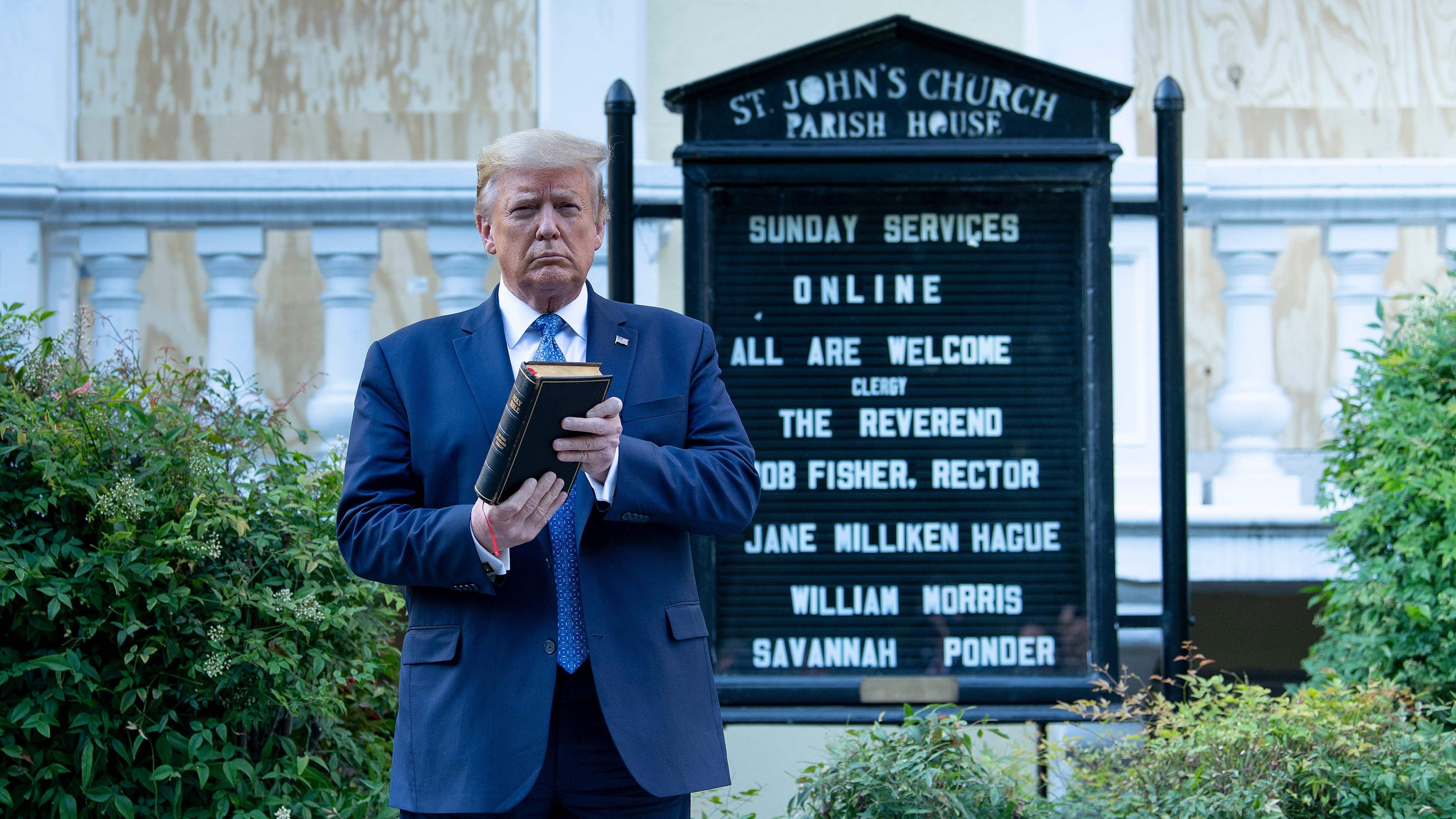 Donald Trump at St. John's Episcopal Church holding a Bible